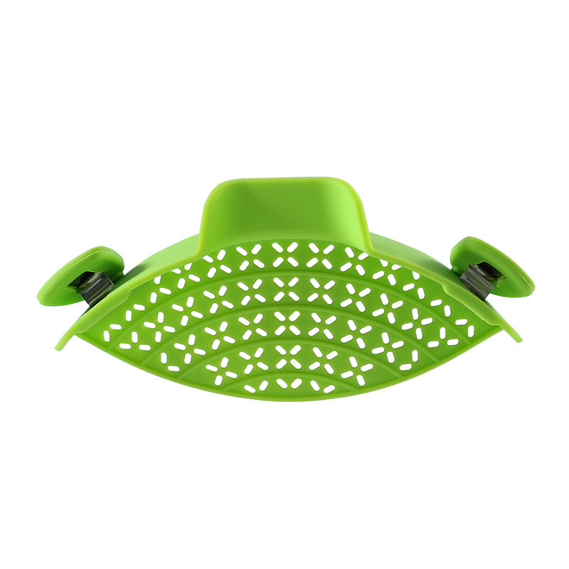 Silicone pot side drain stopper gadget from R&G Boutique, showing flexible silicone design for kitchen drainage solutions.