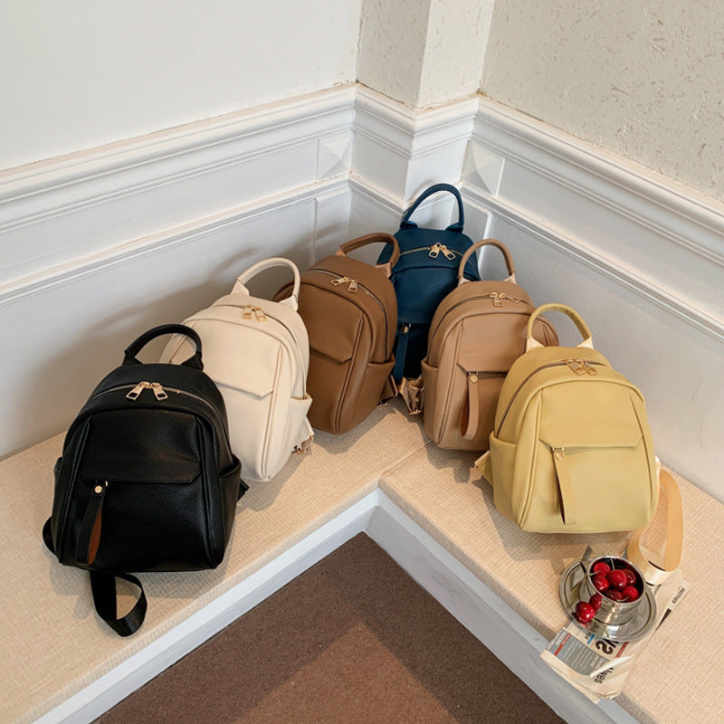 Cute black PU backpack for women by R&G Boutique, small fashion schoolbag with soft material and stylish design.