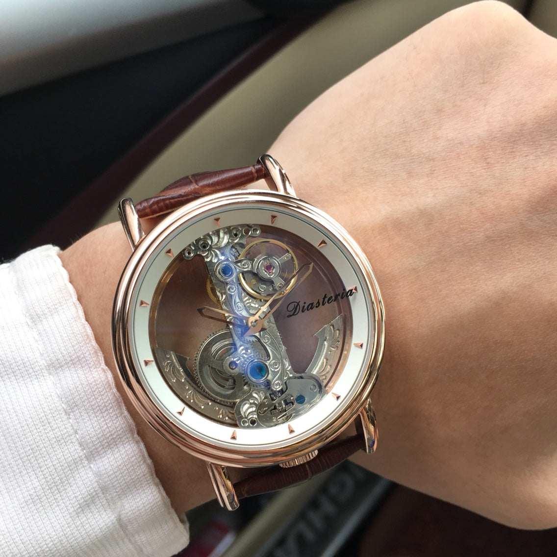 Double-sided hollow men's automatic mechanical watch by R&G Boutique showing the intricate dial and sleek strap.