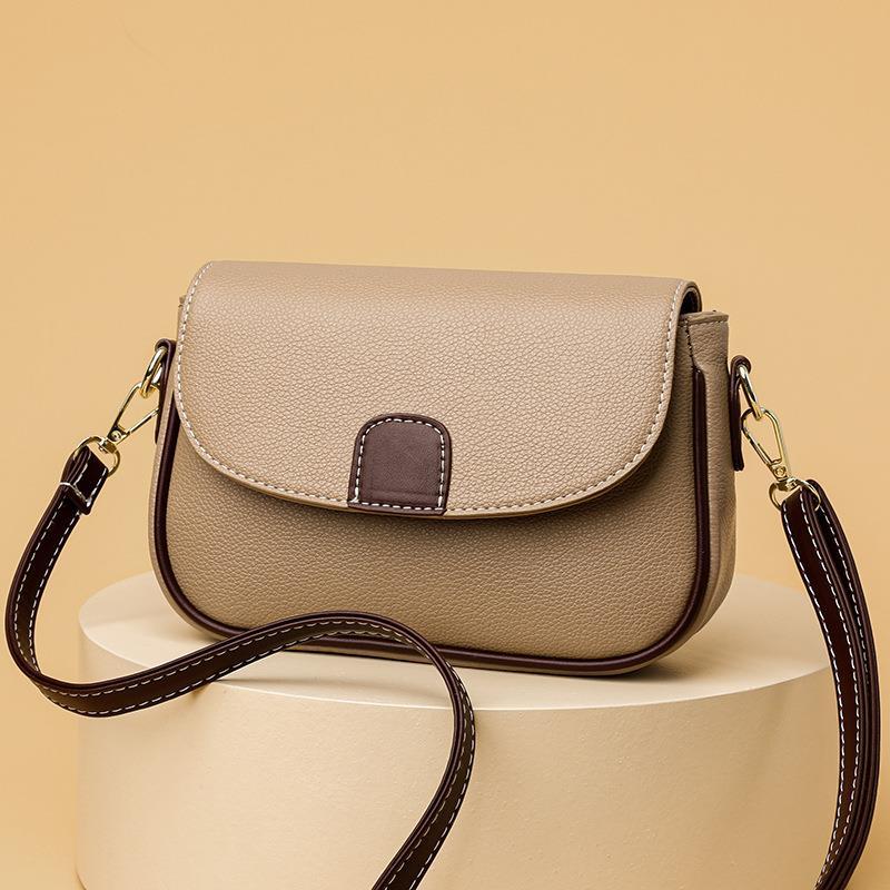 Small square fashion shoulder bag for women by R&G Boutique featuring a flap design, versatile crossbody style, and compact size.