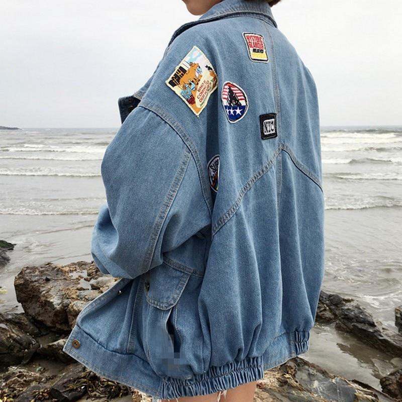 R&G Boutique Esther denim jacket hanging on a hanger, showcasing classic blue denim with button front and chest pockets.