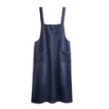 R&G Boutique denim suspenders skirt shown on a model, featuring a classic blue denim fabric and adjustable suspenders.
