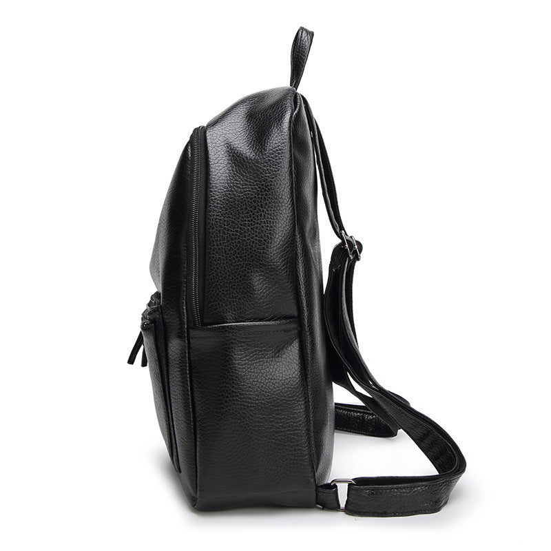 Leather women's backpack bag from R&G Boutique featuring a simple, stylish design with adjustable straps and spacious interior.