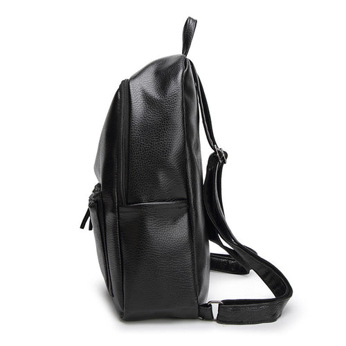 Leather women's backpack bag from R&G Boutique featuring a simple, stylish design with adjustable straps and spacious interior.
