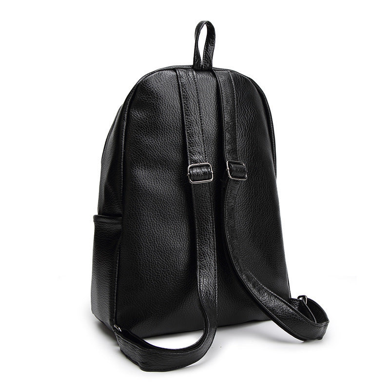 Leather women's backpack bag from R&G Boutique, simple and stylish design with adjustable straps and spacious interior.