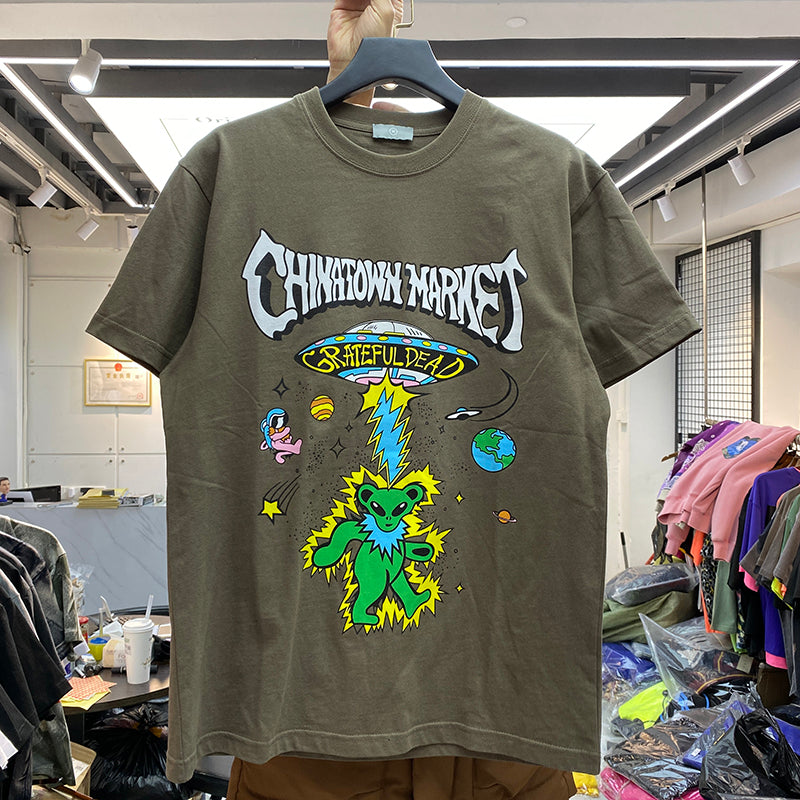 R&G Boutique Star Man cartoon print short sleeve t-shirt with colorful star design on white fabric.