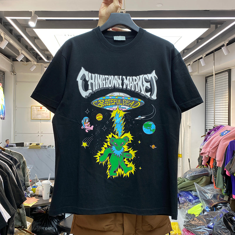 R&G Boutique Star Man cartoon print short sleeve t-shirt featuring a colorful star graphic on the front.