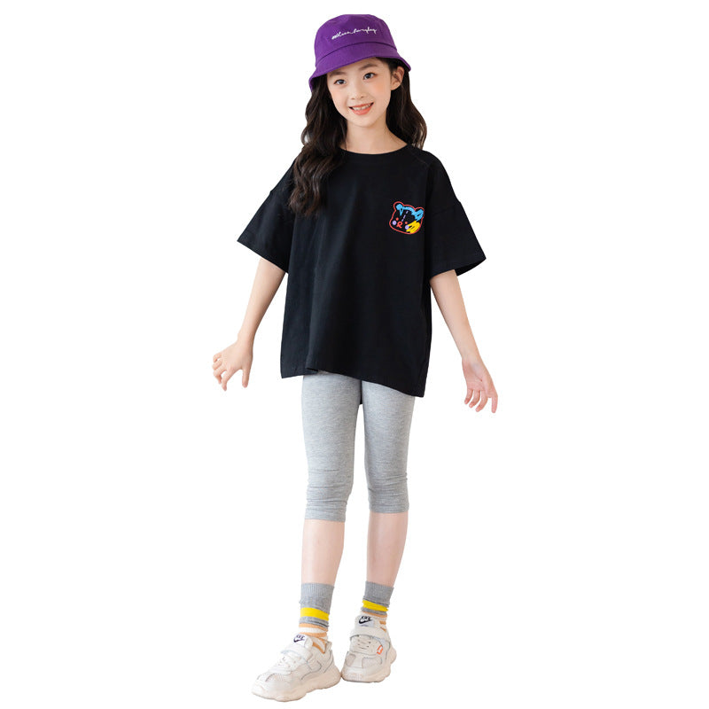 Colorful cartoon irregular top for kids by R&G Boutique, short-sleeved trendy clothing with a playful design.