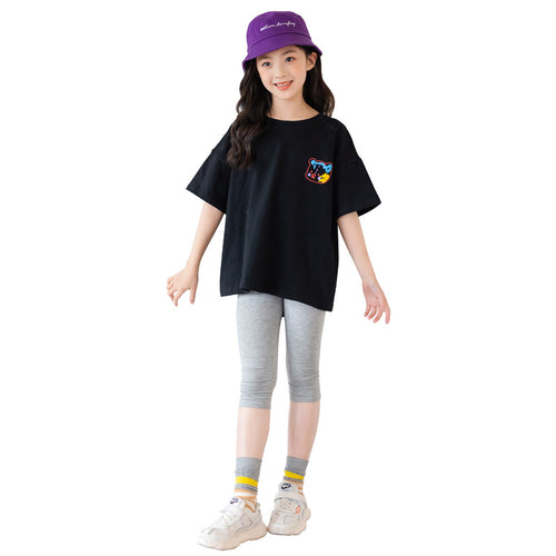 Colorful cartoon irregular top for kids by R&G Boutique, short-sleeved trendy clothing with a playful design.