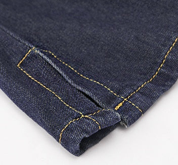 R&G Boutique denim suspenders skirt with adjustable straps and front pockets, styled for casual wear.