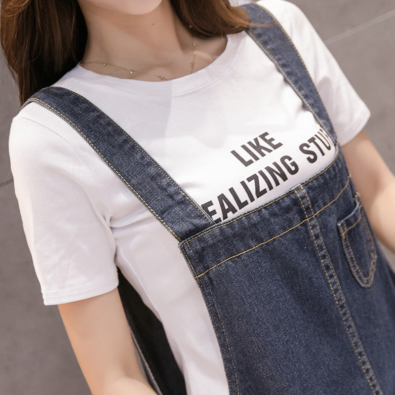 R&G Boutique denim suspenders skirt with adjustable straps and classic denim wash, styled on a mannequin.