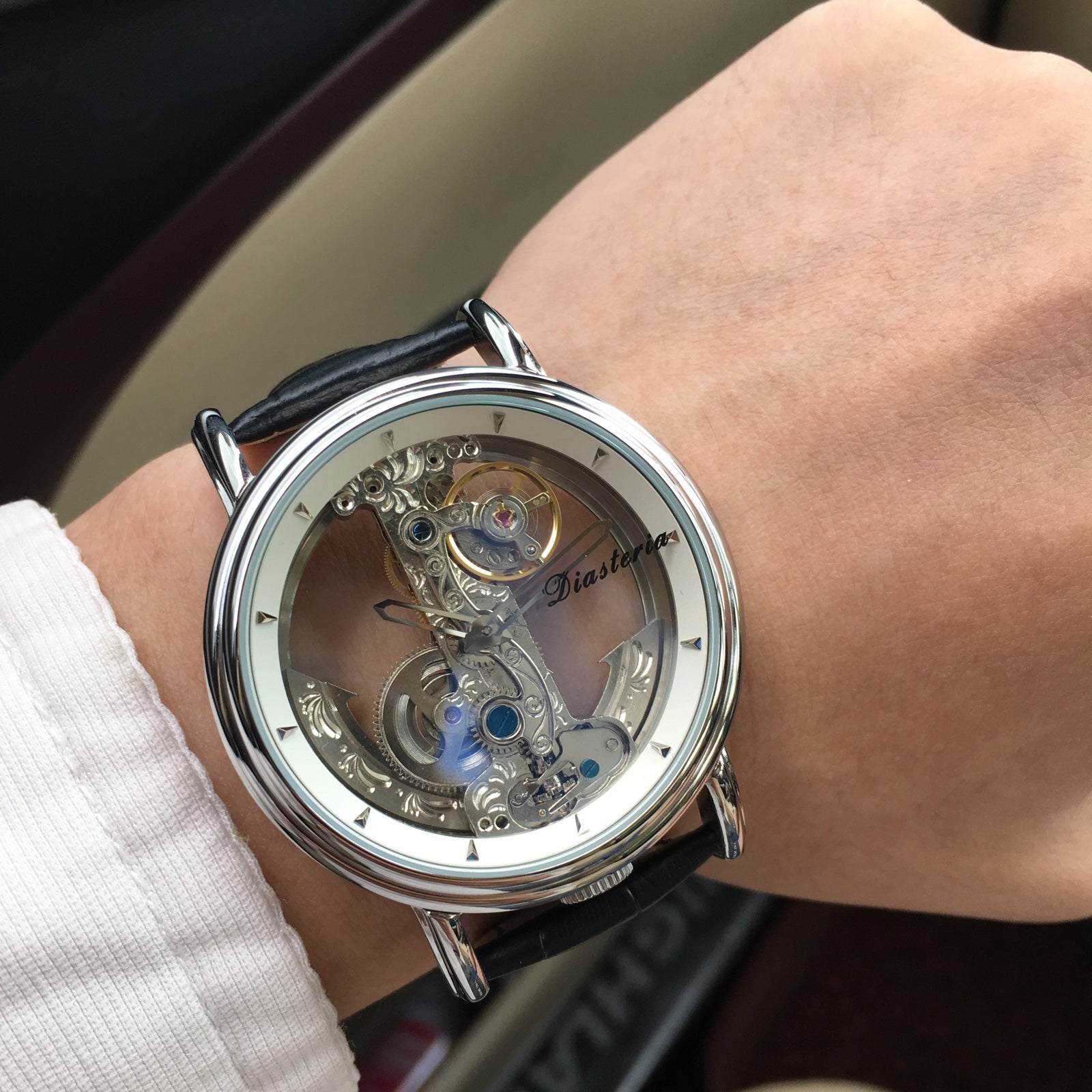 R&G Boutique double-sided hollow men's automatic mechanical watch with intricate dial and stainless steel strap.