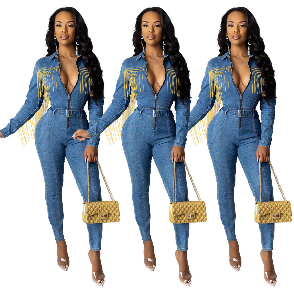 R&G Boutique fringed denim jumpsuit with wide legs and distressed details, shown on a model in a casual outdoor setting.