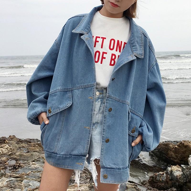 R&G Boutique Esther denim jacket displayed on a hanger, featuring classic blue denim with button-front and collar details.