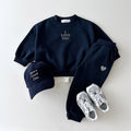 Kids' embroidered letter love sweater and matching pants set by R&G Boutique, featuring colorful embroidery and cozy fabric.