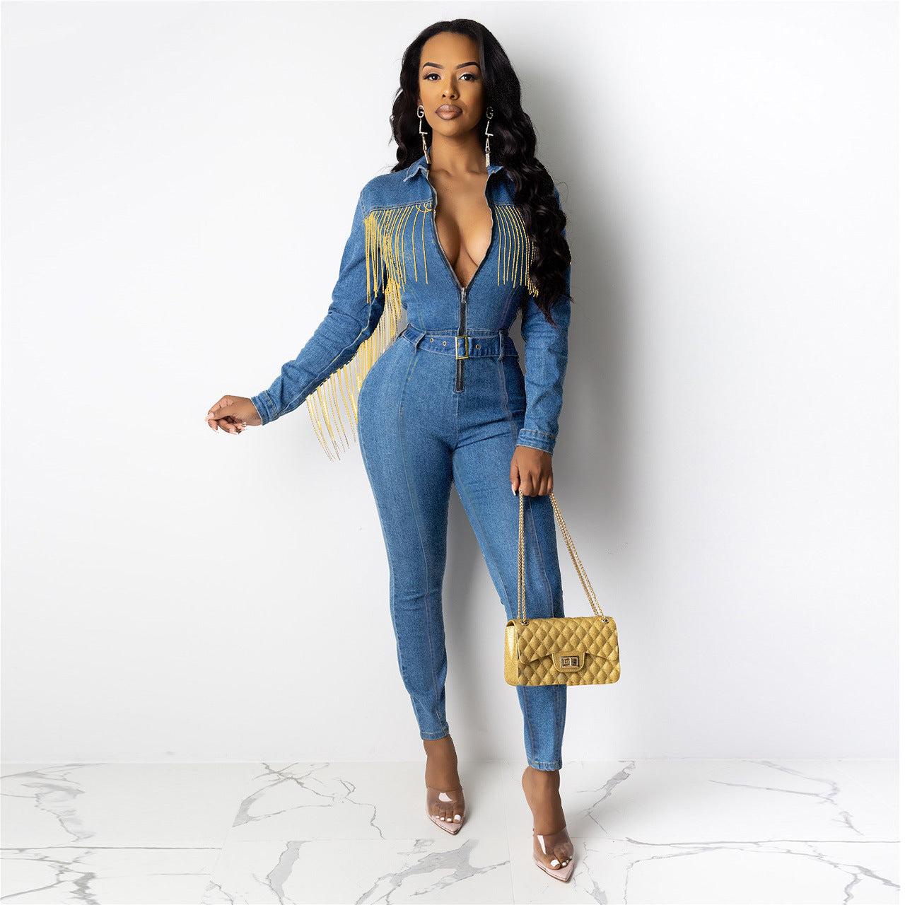R&G Boutique fringed denim jumpsuit with wide legs and distressed detailing, displayed on a hanger against a neutral background.