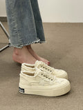Women's thick-soled denim canvas shoes by R&G Boutique with stylish, casual design and sturdy rubber soles.