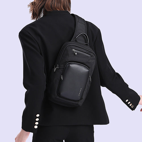 Large capacity men's chest bag by BANGE with crossbody strap, black synthetic material, and multiple compartments for everyday use.
