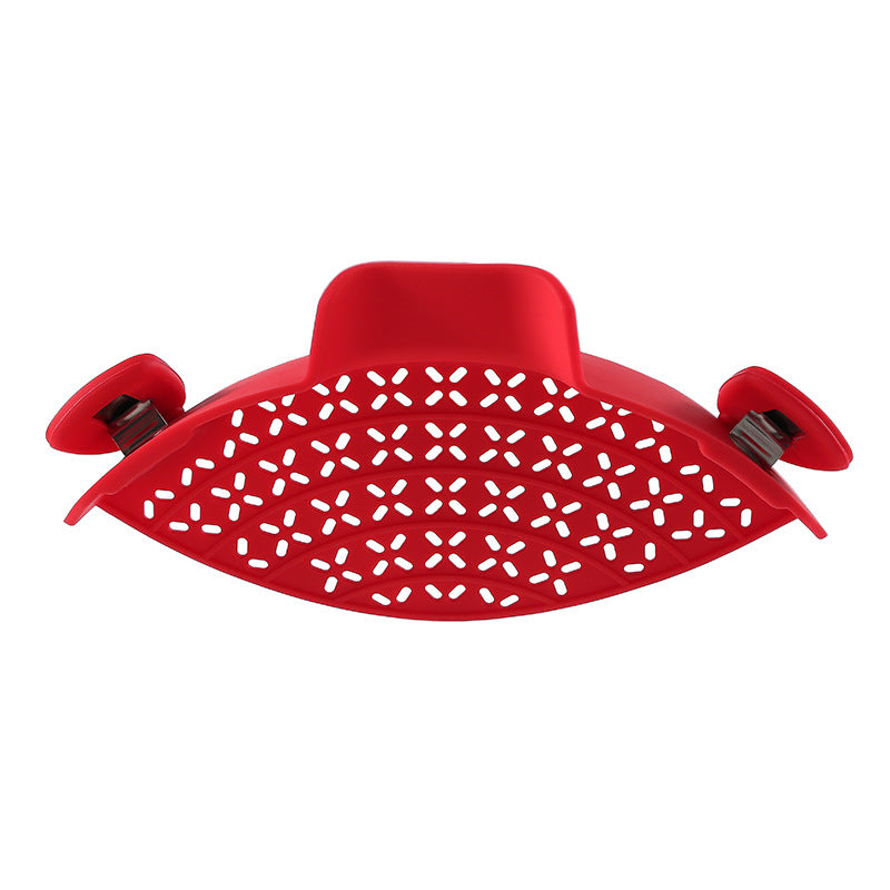 Silicone pot side drain stopper from R&G Boutique kitchen gadgets, designed to fit securely on pot edges for easy draining.