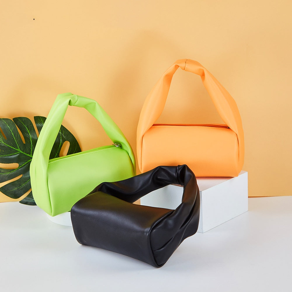 Mini candy color toiletry storage bag for women from R&G Boutique, portable cosmetic bag with vibrant, compact design.
