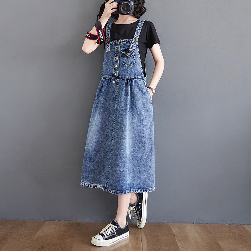 R&G Boutique denim suspender skirt dress featuring classic denim fabric and adjustable straps, styled with a casual, trendy look.