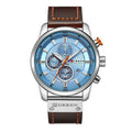 Men's quartz watch with round dial and black leather strap from R&G Boutique, displayed on a neutral background.