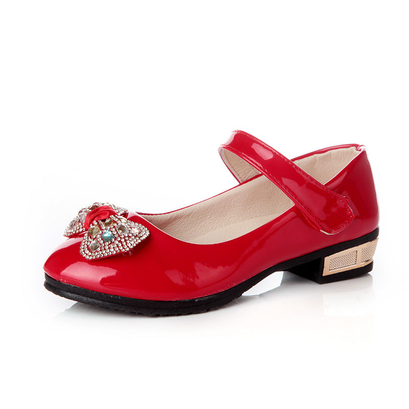 Cute girls' leather shoes with bowknot detail from R&G Boutique, featuring a stylish design and comfortable fit.