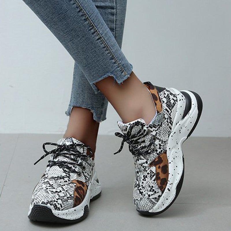 Leopard print women's sneakers by R&G Boutique with lace-up design, perfect for walking, running, and sports activities.