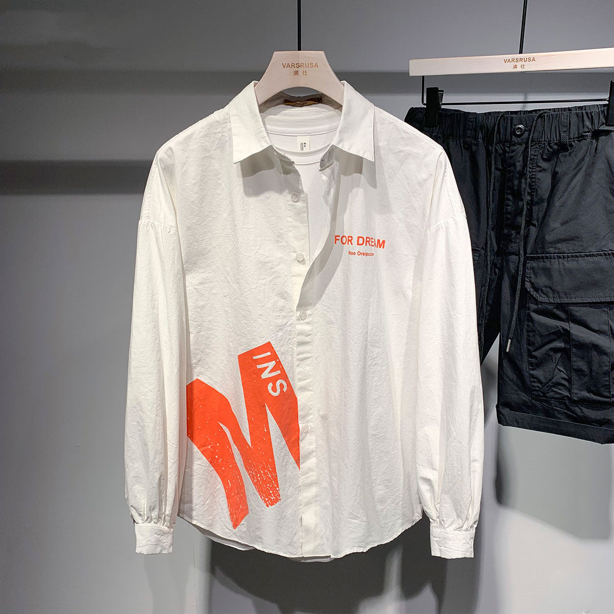 Creative letter print sunscreen shirt by R&G Boutique, featuring a stylish design with bold letter patterns on lightweight fabric.