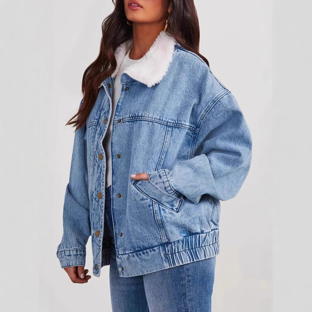 Women's denim jacket with fur collar from R&G Boutique, showing the classic blue denim coat with cozy fur trim.