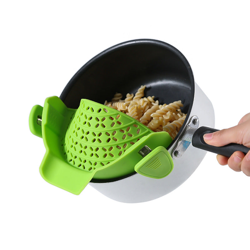 R&G Boutique silicone pot side drain stopper, kitchen gadget for sealing and draining pots, made of flexible silicone material.