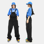 Men's loose denim jumpsuit by R&G Boutique featuring working bib top pants with functional pockets and relaxed fit.