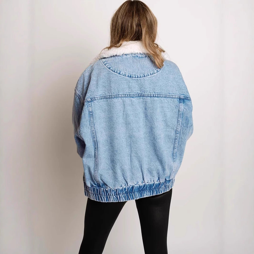 Women's denim jacket with fur collar by R&G Boutique, featuring classic blue denim and cozy fur trim.