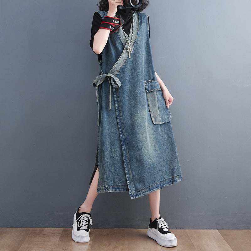 Vintage denim waistcoat camisole dress with diagonal placket and lace-up details, styled for women by R&G Boutique.