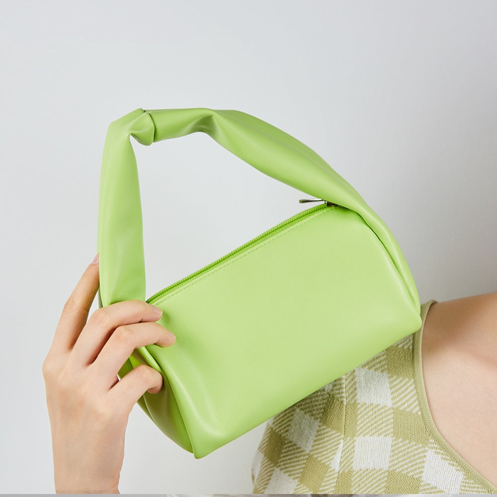 Mini candy color women's cosmetic bag from R&G Boutique, portable toiletry storage with vibrant, stylish design.