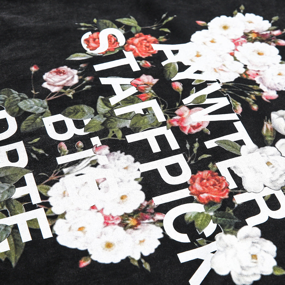Men's short-sleeve T-shirt with fashion flower letter print, featuring casual style and vibrant graphic design by R&G Boutique.