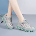 Women's mesh surface hollowed height increasing insoles inside breathable sneakers, showing the insole's textured surface and shoe interior.