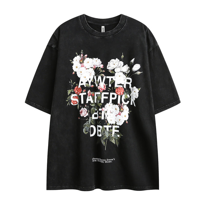 Men's short-sleeve t-shirt with floral letter print from R&G Boutique, showcasing a casual fashion design with colorful flower accents.
